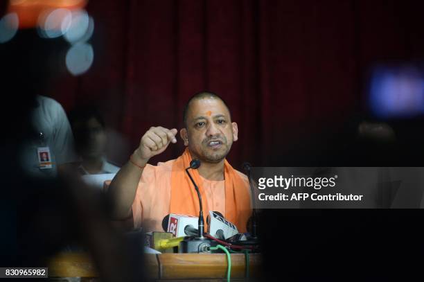Chief Minister of Uttar Pradesh , Yogi Adityanath gestures during a press confrence after visiting the Baba Raghav Das Hospital in Gorakhpur, in the...