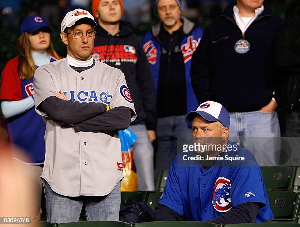 Fans of the Chicago Cubs looks on dejected as the Los Angeles Dodgers beat the Cubs 10-3 in Game Two of the NLDS during the 2008 MLB Playoffs at...