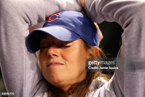 Leela Sullivan, a fan of the Chicago Cubs, looks on dejected as they Cubs lost 10-3 against the Los Angeles Dodgers in Game Two of the NLDS during...