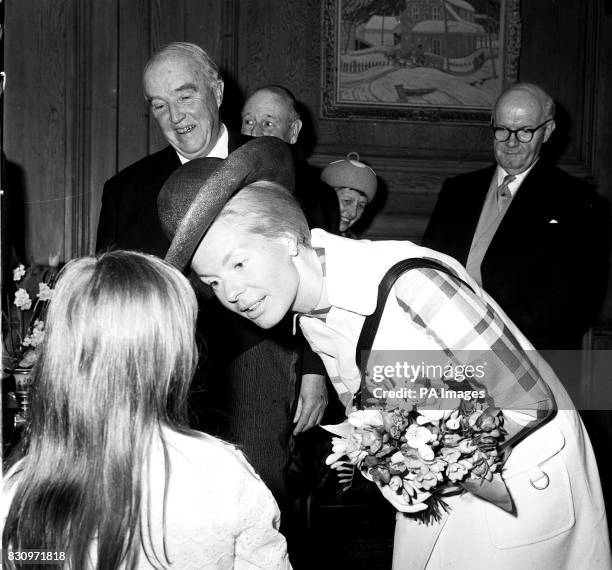 The Duchess of Kent thanks Sally Dutton a diabetic, for presenting her with a bouquet at a reception at the Canadian High Commissioner's residence to...