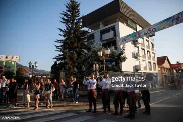 Brass band plays in the streets for the wakening call of the trumpeters during the Guca Trumpet Festival on August 11, 2017 in Guca, Serbia....