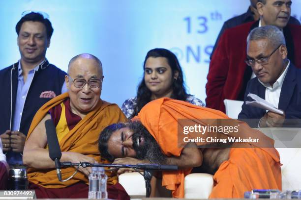 His Holiness The 14th Dalai Lama with Yoga guru Baba Ramdev World Peace & Harmony Conclave at NSCI Dome on August 13, 2017 in Mumbai, India.