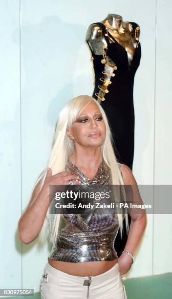 Donatella Versace talks to the media during a photocall at the Victoria and Albert Museum in London, where she opened a retrospective collection of...