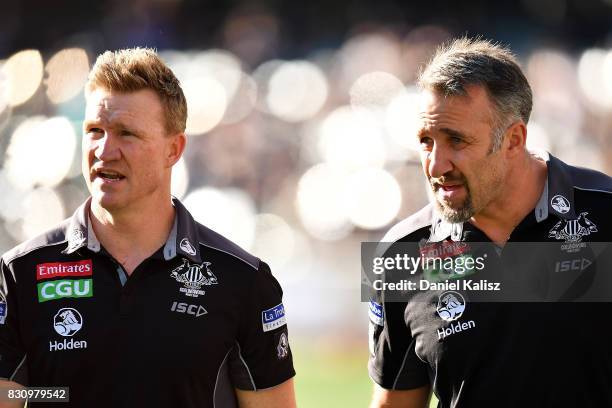 Magpies head coach Nathan Buckley and Anthony Rocca fowards development coach look on during the round 21 AFL match between Port Adelaide Power and...