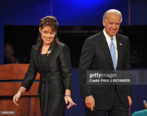 Republican Sarah Palin and Democrat Joseph Biden walk on stage following their vice presidential debate on October 2, 2008 at Washington University...