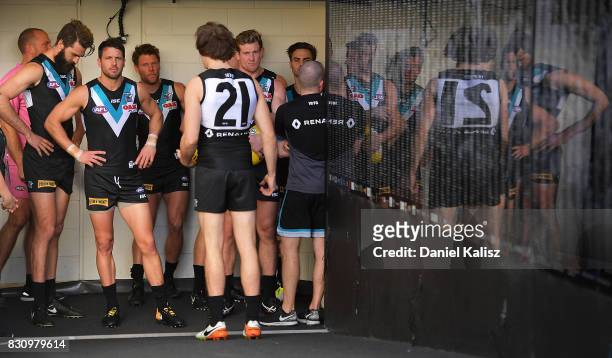 Travis Boak of the Power prepares to lead his team onto the gound during the round 21 AFL match between Port Adelaide Power and the Collingwood...