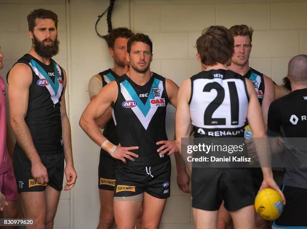 Travis Boak of the Power prepares to lead his team onto the gound during the round 21 AFL match between Port Adelaide Power and the Collingwood...