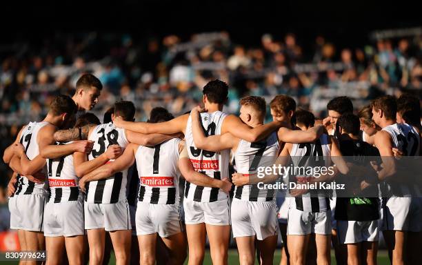 The Magpies playes huddle prior to the round 21 AFL match between Port Adelaide Power and the Collingwood Magpies at Adelaide Oval on August 13, 2017...