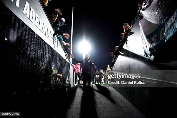 Ken Hinkley the coach of the Power walks from the field after during the round 21 AFL match between Port Adelaide Power and the Collingwood Magpies...