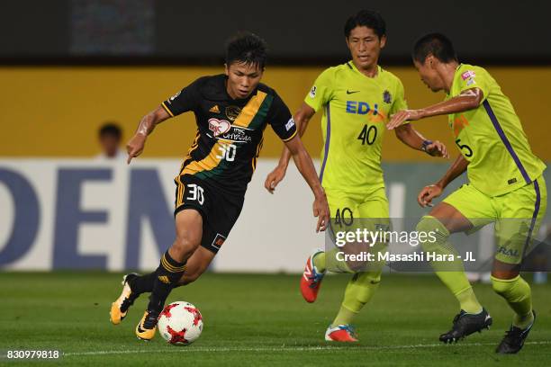 Takuma Nishimura of Vegalta Sendai takes on Kazuhiko Chiba of Sanfrecce Hiroshima during the J.League J1 match between Vegalta Sendai and Sanfrecce...