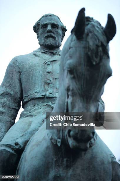 The statue of Confederat Gen. Robert E. Lee stands in the center of Emancipation Park the day after the Unite the Right rally devolved into violence...