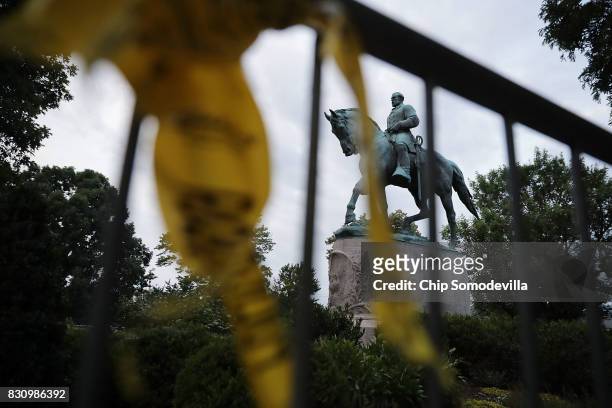 The statue of Confederat Gen. Robert E. Lee stands in the center of Emancipation Park the day after the Unite the Right rally devolved into violence...