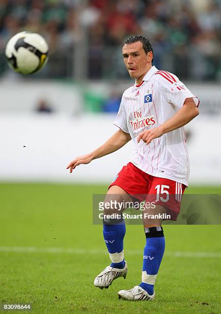 Piotr Trochowski of Hamburg passes the ball during the Bundesliga match between VfL Wolfsburg and Hamburger SV at the Volkswagen Arena on September...