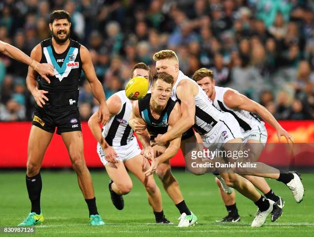 Robbie Gray of the Power handballs during the round 21 AFL match between Port Adelaide Power and the Collingwood Magpies at Adelaide Oval on August...