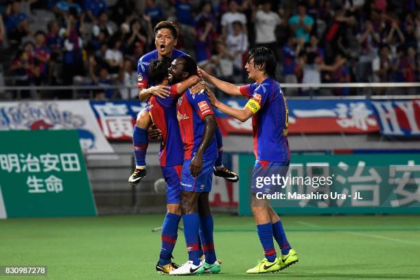 Peter Utaka of FC Tokyo celebrates scoring the opening goal with his team mates during the J.League J1 match between FC Tokyo and Vissel Kobe at...
