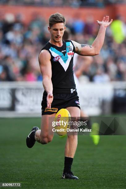 Hamish Hartlett of the Power kicks the ball during the round 21 AFL match between Port Adelaide Power and the Collingwood Magpies at Adelaide Oval on...