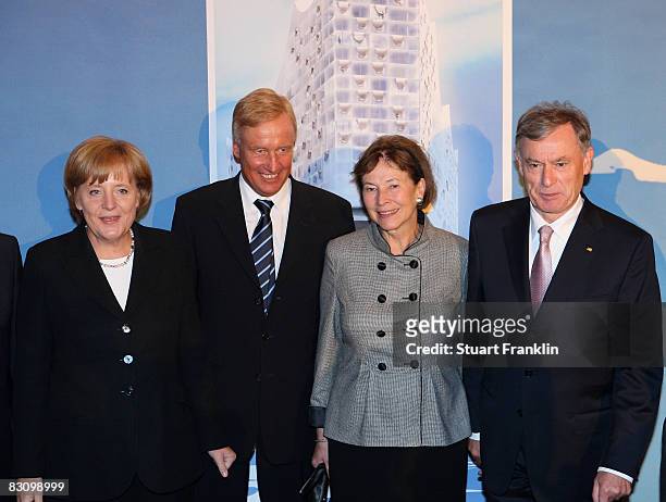 German chancellor Angel Merkel, Mayor of Hamburg Ole Von Beust, German president Horst Koehler and wife Eva Louisa pose for photographers at the Lion...