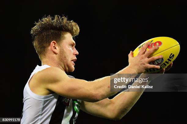 Taylor Adams of the Magpies marks the ball during the round 21 AFL match between Port Adelaide Power and the Collingwood Magpies at Adelaide Oval on...