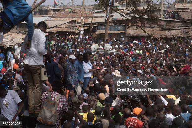 Opposition candidate Raila Odinga addresses a crowd in the Kibera slum on August 13, 2017 in Nairobi, Kenya. A day prior, demonstrations turned...