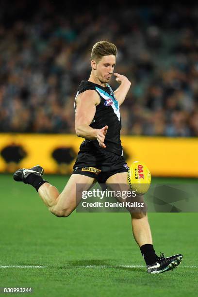 Hamish Hartlett of the Power kicks the ball during the round 21 AFL match between Port Adelaide Power and the Collingwood Magpies at Adelaide Oval on...