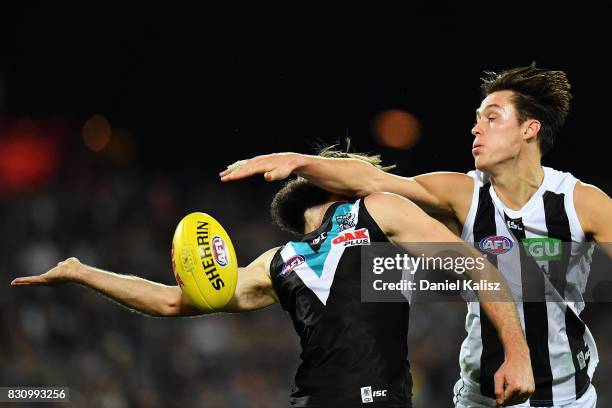 Justin Westhoff of the Power competes for the ball with Darcy Moore of the Magpies during the round 21 AFL match between Port Adelaide Power and the...