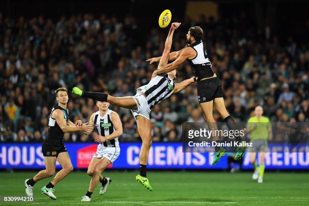 Darcy Moore of the Magpies and Patrick Ryder of the Power compete for the ruck during the round 21 AFL match between Port Adelaide Power and the...