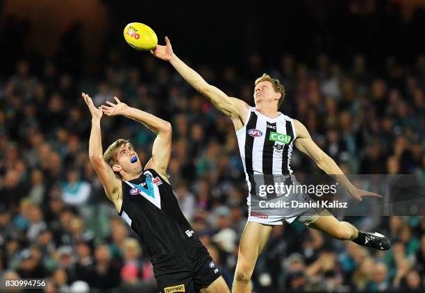 Dougal Howard of the Power competes for the ball with Ben Reid of the Magpies during the round 21 AFL match between Port Adelaide Power and the...