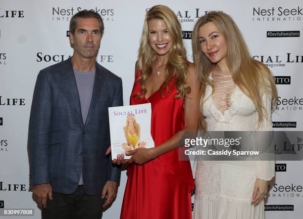 Justin Mitchell, Beth Stern and Devorah Rose attend the Social Life Magazine Nest Seekers August Issue Party on August 12, 2017 in Southampton, New...