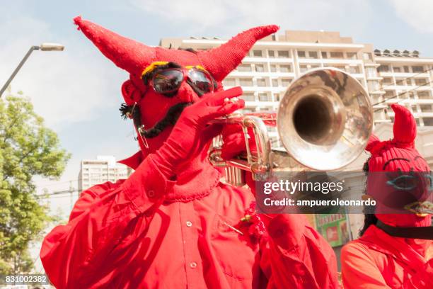 masked "los diablos rojos" "the red devils" - yellow song 2013 stock pictures, royalty-free photos & images