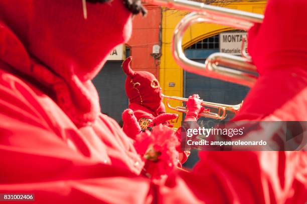 masked "los diablos rojos" "the red devils" - yellow song 2013 stock pictures, royalty-free photos & images