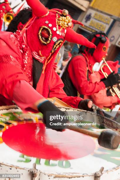 masked "los diablos rojos" "the red devils" - yellow song 2013 stock pictures, royalty-free photos & images