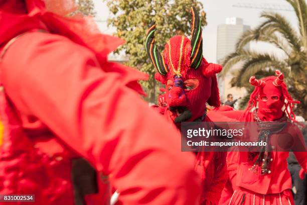 masked "los diablos rojos" "the red devils" - yellow song 2013 stock pictures, royalty-free photos & images