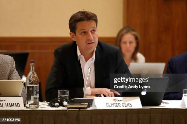 Olivier Gers, CEO of the IAAF, talks with to the council members during the 211th IAAF Council Meeting on August 13, 2017 in London, England.