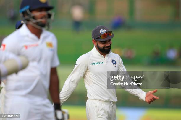 Indian cricket captain Virat Kohli reacts after Sri Lanka's 1st innings finished during the 2nd Day's play in the 3rd Test match between Sri Lanka...