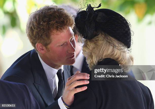Prince Harry greets Camilla, Duchess of Cornwall as they attend a thanksgiving service for Prince Harry's godfather Gerald Ward at St Mary's Church,...