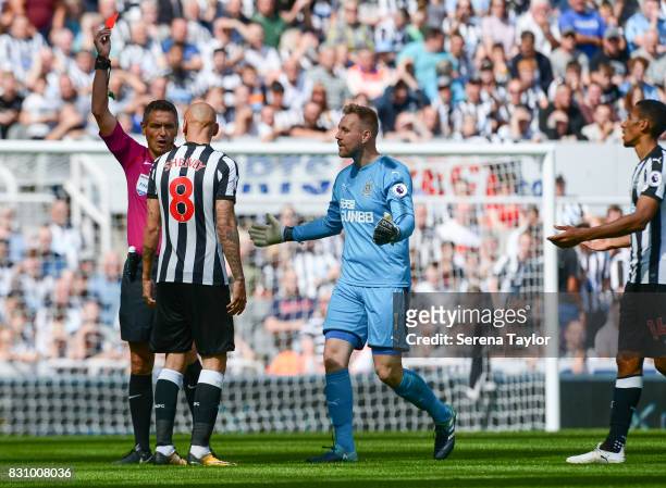Referee Andre Marriner shows Jonjo Shelvey of Newcastle United a red card during the Premier League Match between Newcastle United and Tottenham...
