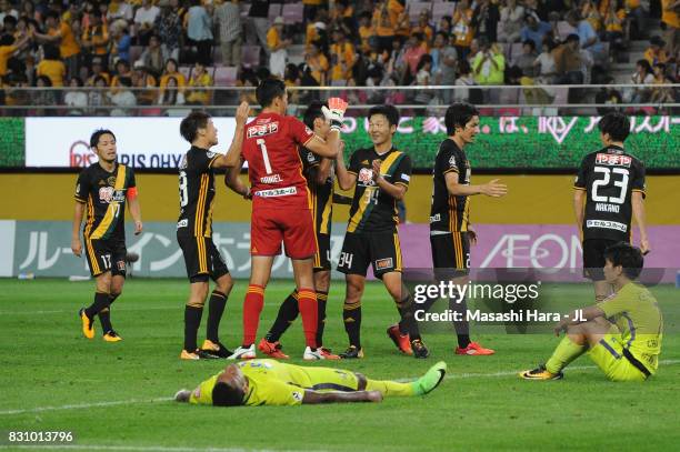 Vegalta Sendai players celebrate while Anderson Lopes and Yusuke Chajima of Sanfrecce Hiroshima show dejection after the J.League J1 match between...