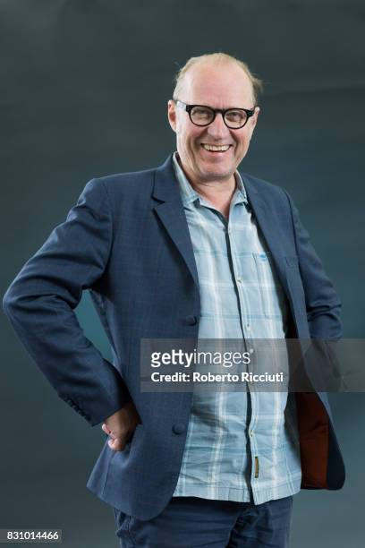 English comedian, actor, writer, musician, television presenter and director Ade Edmondson attends a photocall during the annual Edinburgh...