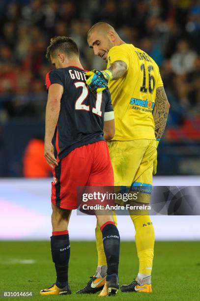 Frederic Guilbert of Caen and Stephane Ruffier of Saint Etienne during the Ligue 1 match between SM Caen and AS Saint Etienne at Stade Michel...