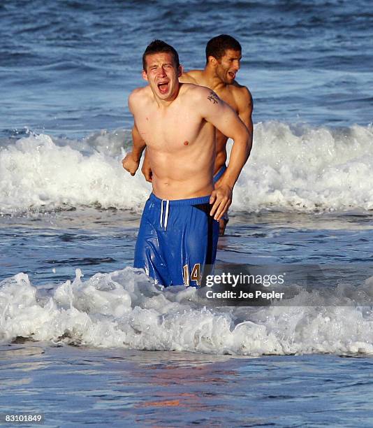 Portsmouth's David James and Sean Davis paddle in the Atlantic Ocean following their late night victory in the UEFA Cup Ist round 2nd leg match...