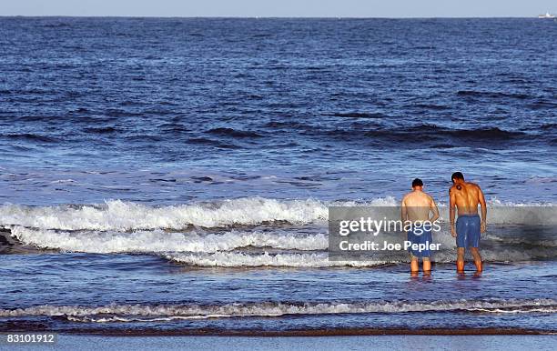 Portsmouth's David James and Sean Davis paddle in the Atlantic Ocean following their late night victory in the UEFA Cup Ist round 2nd leg match...