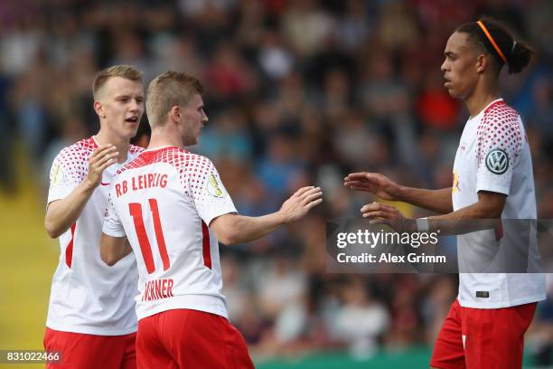 Timo Werner celebrates his team's third goal with team mates Lukas Klostermann and Yussuf Poulsen during the DFB Cup first round match between...