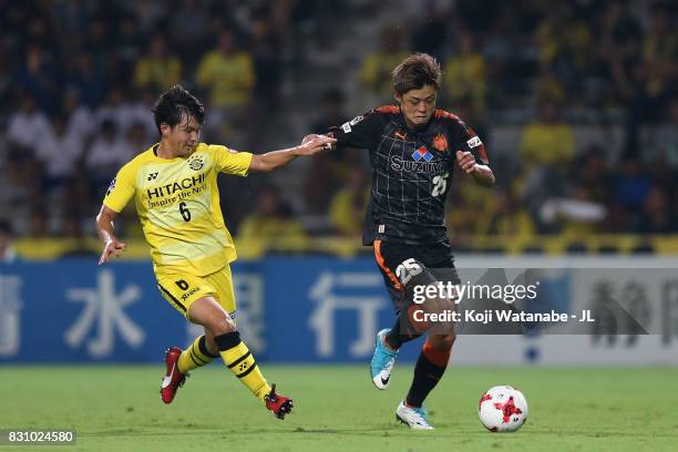 Ko Matsubara of Shimizu S-Pulse and Yusuke Kobayashi of Kashiwa Reysol compete for the ball during the J.League J1 match between Shimizu S-Pulse and...