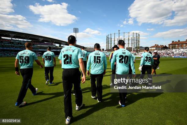 The Surrey team make their way out to the field during the NatWest T20 Blast match between Surrey and Sussex Shark at The Kia Oval on August 13, 2017...
