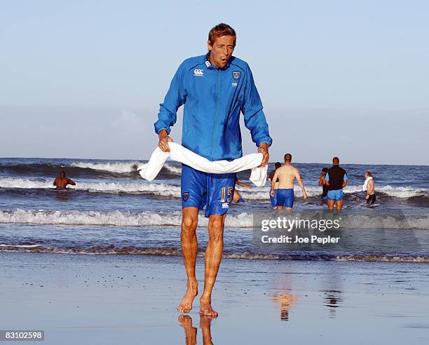 Portsmouth's Peter Crouch feels the chill as the team celebrate in the Atlantic Ocean following their late night victory in the UEFA Cup Ist round...