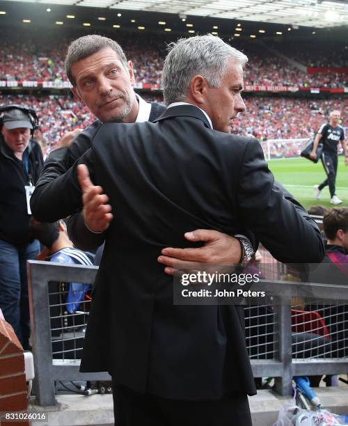 Manager Jose Mourinho of Manchester United greets Manager Slaven Bilic of West Ham United ahead of the Premier League match between Manchester United...