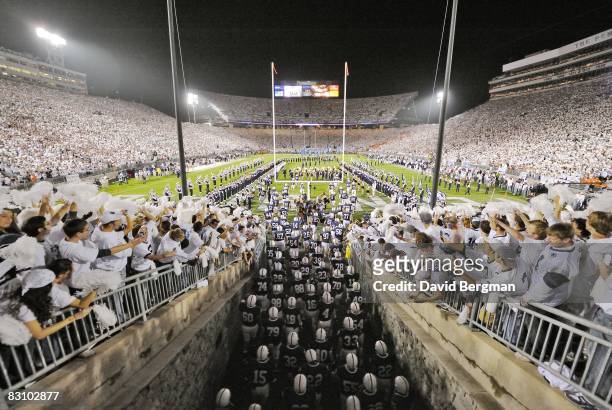 Penn State fans dressed for "White Out" game as team enters Beaver Stadium from tunnel before game vs Illinois. University Park, PA 9/27/2008 CREDIT:...
