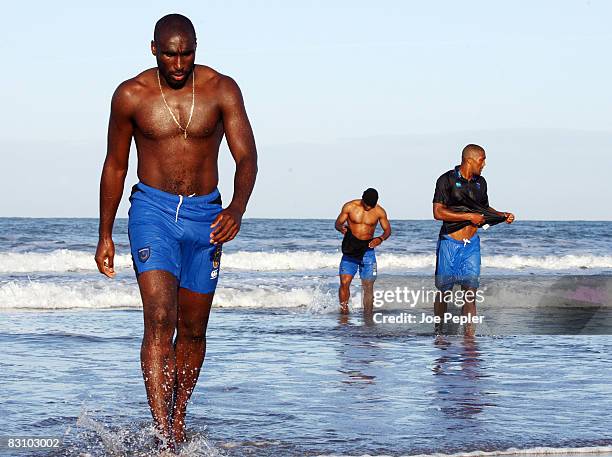 Portsmouth's Sol Campbell walks in the surf as the team celebrate in the Atlantic Ocean following their late night victory in the UEFA Cup Ist round...