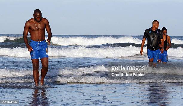 Portsmouth's Sol Campbell walks in the surf as the team celebrate in the Atlantic Ocean following their late night victory in the UEFA Cup Ist round...