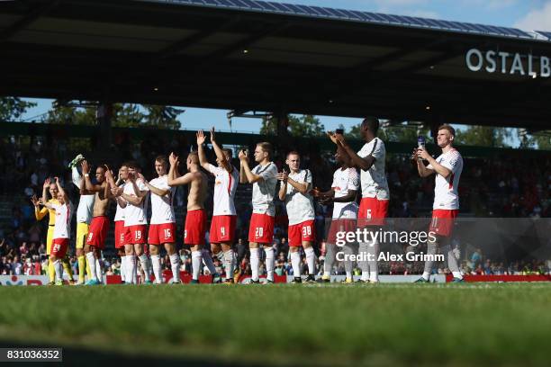 Players of Leipzig celebrate with the fans after the DFB Cup first round match between Sportfreunde Dorfmerkingen and RB Leipzig at Ostalb-Arena on...